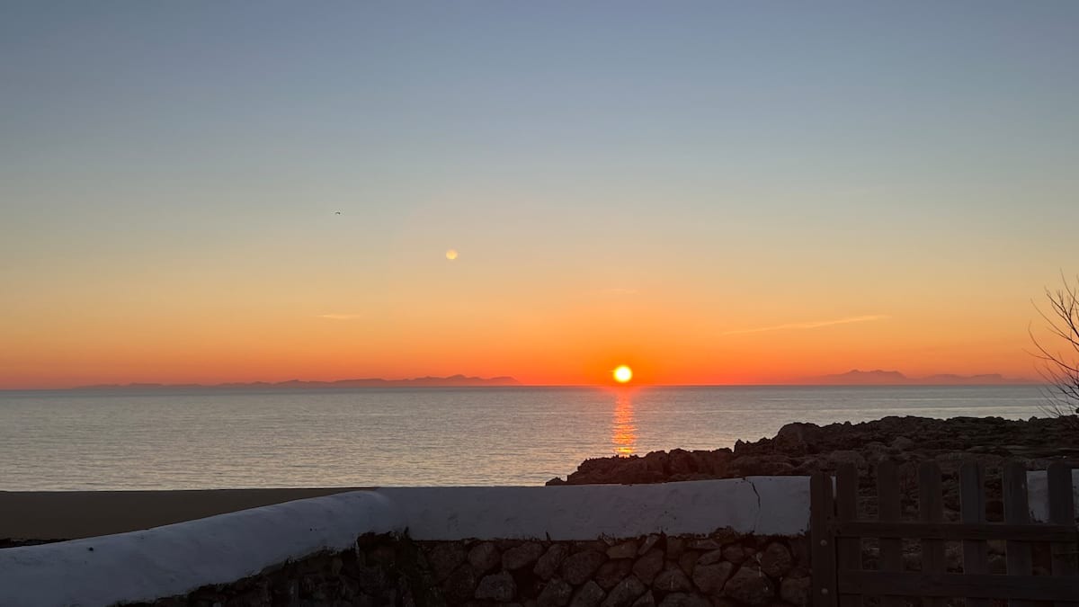 Sunset over the sea, from the garden